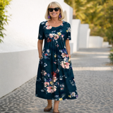 Robin | Cvjetna Midi Haljina" can be rewritten as "Robin | Floral Midi Dress.